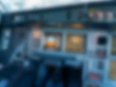 The captain&rsquo;s side of the A340-600 instrument panel, with the primary flight display, navigation display, and glareshield controls