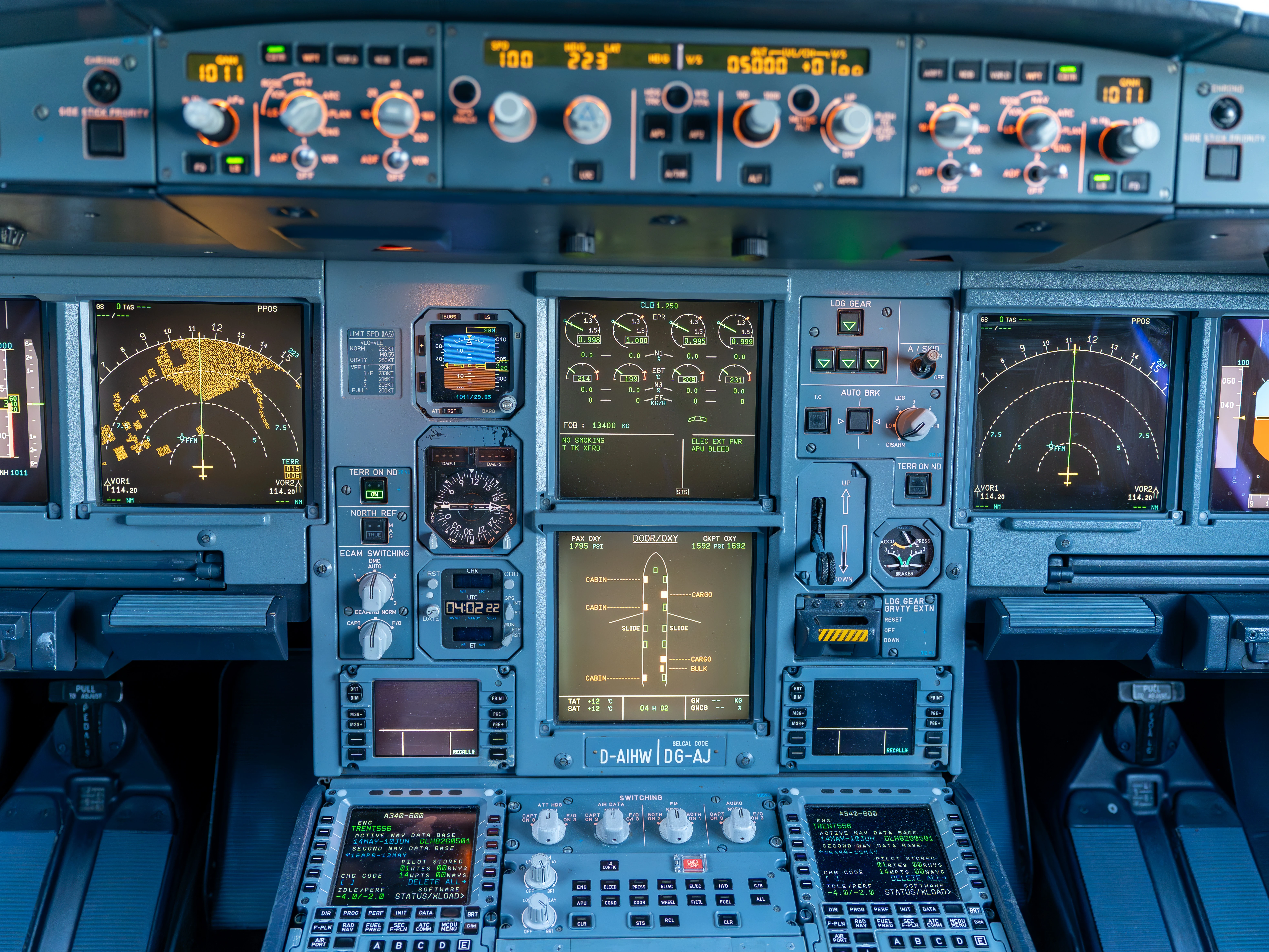 The full A340-600 main instrument panel, with the central engine and system displays and the registration D-AIHW